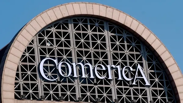 Comerica signage is seen on the exterior of a building