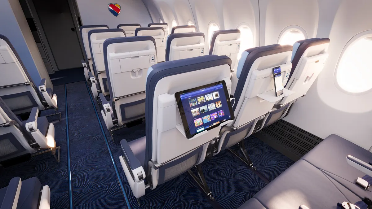 Southwest Airlines' redesigned cabin features deep blues and new seats with electronic device holders.