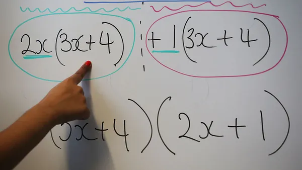 A person's hand is shown pointing to algebraic equations on a whiteboard, illustrating mathematical processes to unseen onlookers.