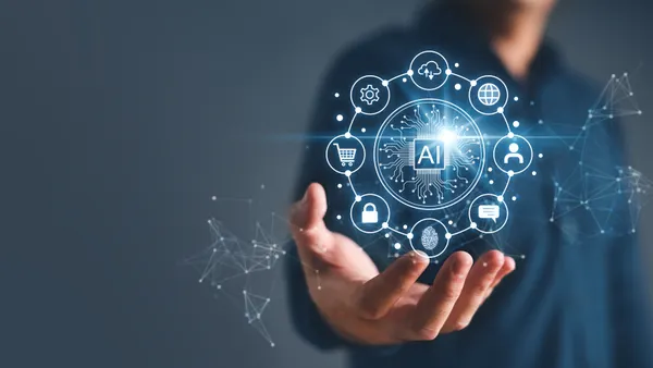 Artificial intelligence and automated machine learning language blue digital user interface with businessman's hand.
