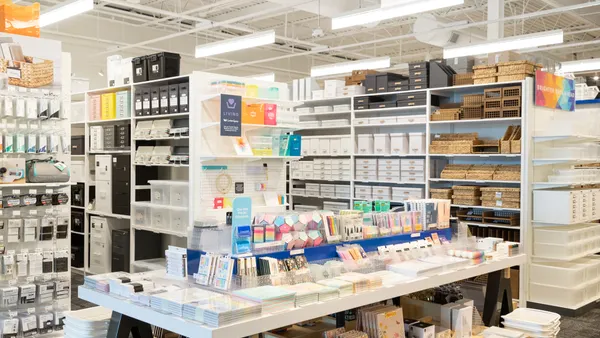 A display of office products on a table inside of a Container Store.