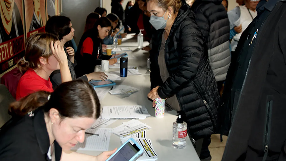 A photo of hotel workers voting to authorize a strike in Southern California.