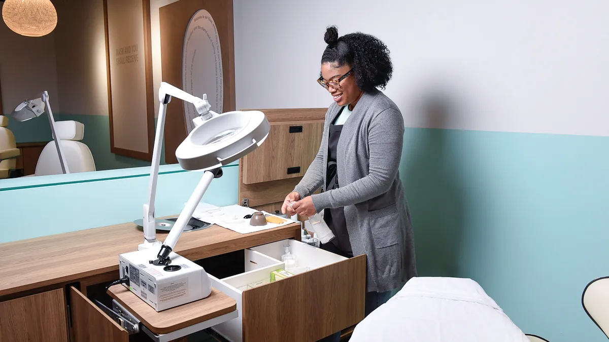 A Face Haus esthetician prepping her work space for a customer.