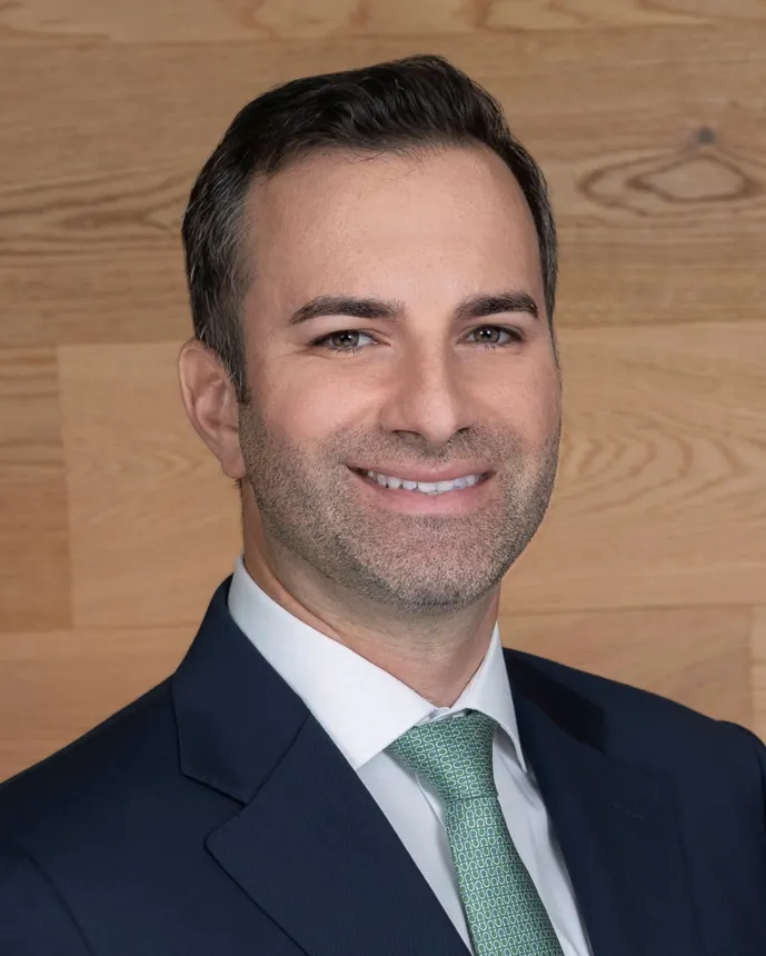 Headshot of a man in professional attire.