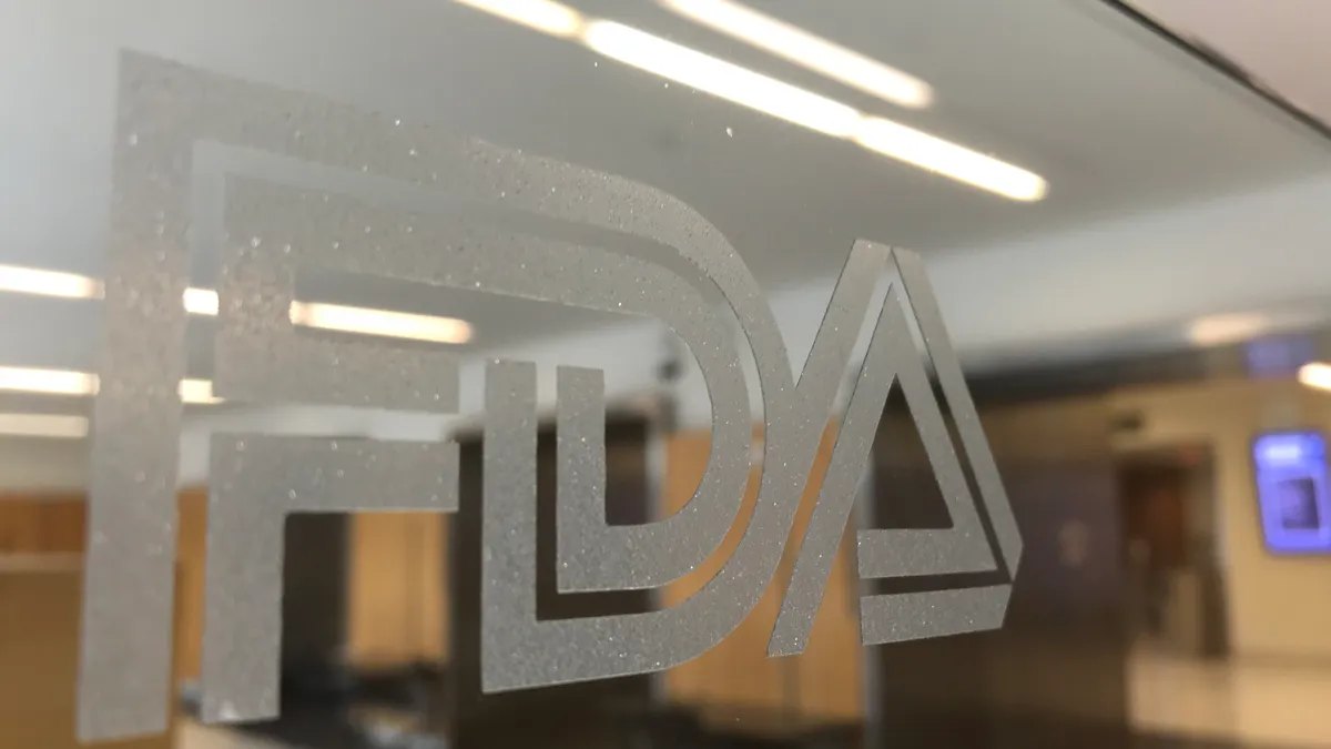 The FDA logo on a glass pane at the agency's campus in Silver Spring, Maryland.