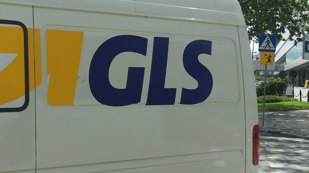 The GLS logo is displayed on a vehicle.