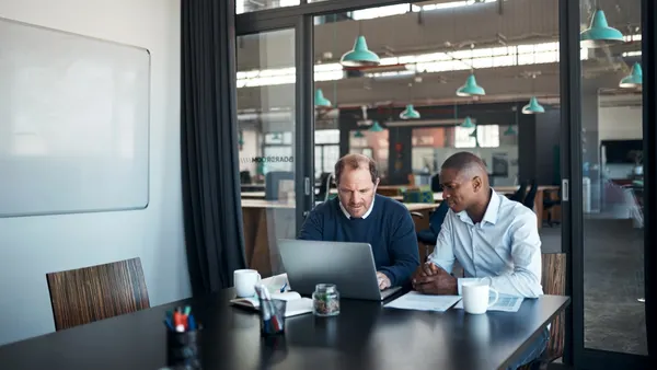 Two people working in an office