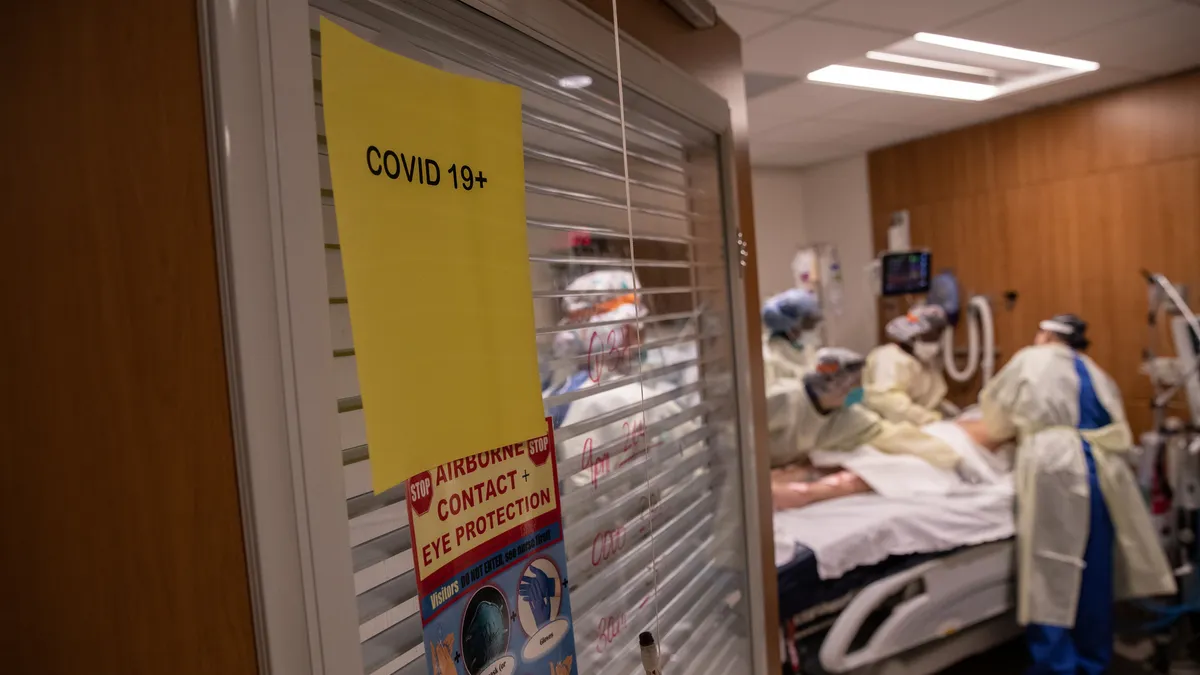 A COVID patient in a hospital bed