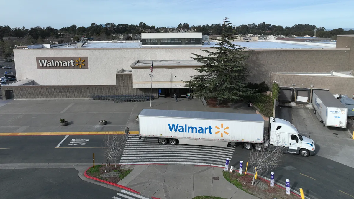 Aerial view of Walmart truck in front of storefront