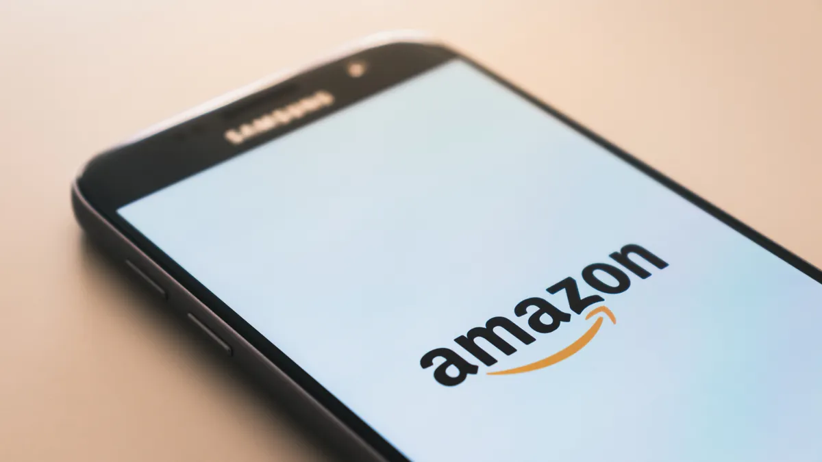 Mobile phone that shows the Amazon logo in the center on a white background.