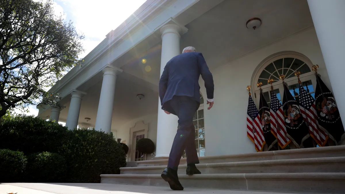 President Joe Biden walks toward the Oval Office.