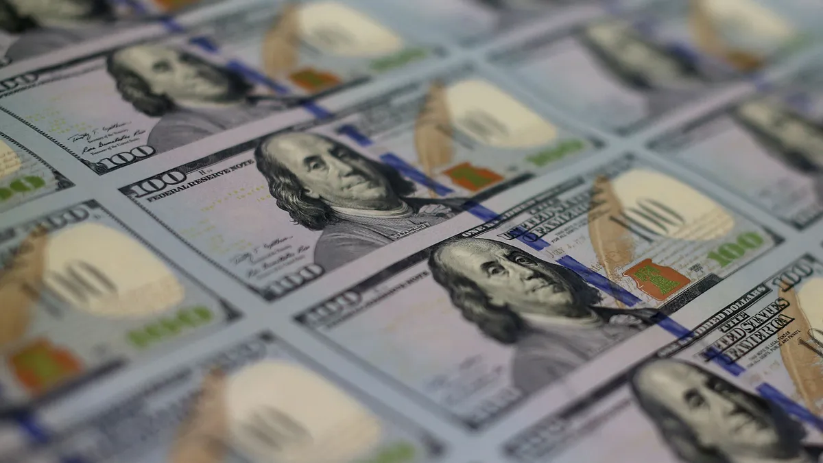 Close-up view of a row of $100 bills