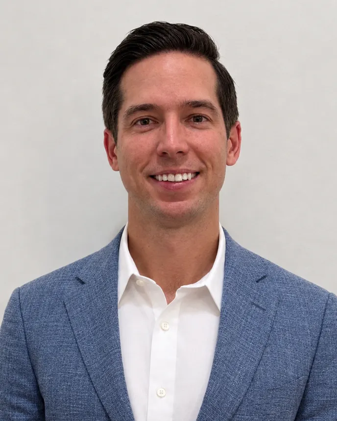 Headshot of a man in a suit.