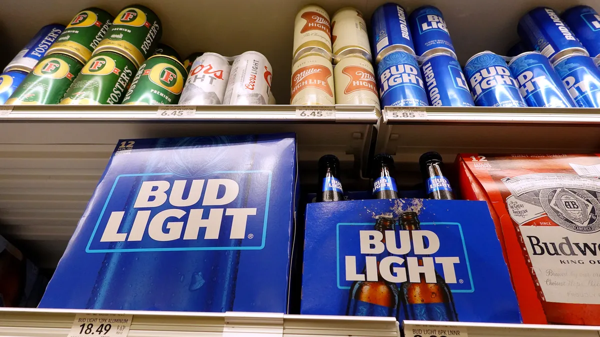 Bud Light sits on a store shelf.