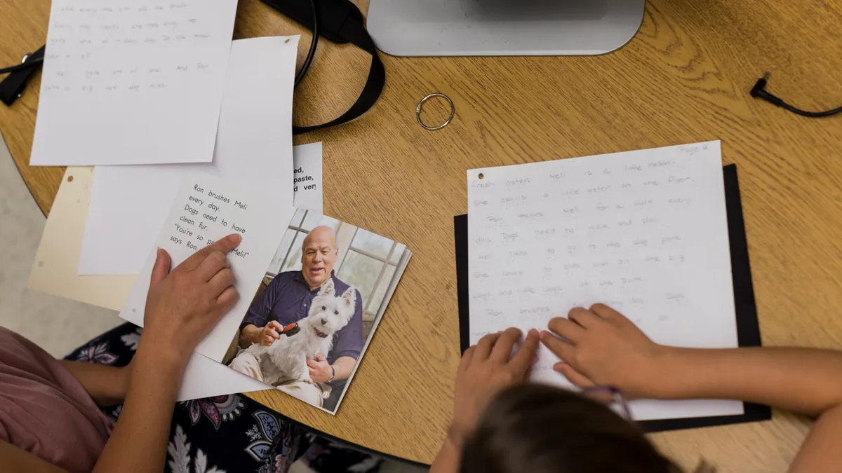 A student with a visual impairment works with a Future In Sight educator.