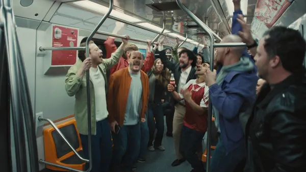 People on the subway celebrate the Olympics