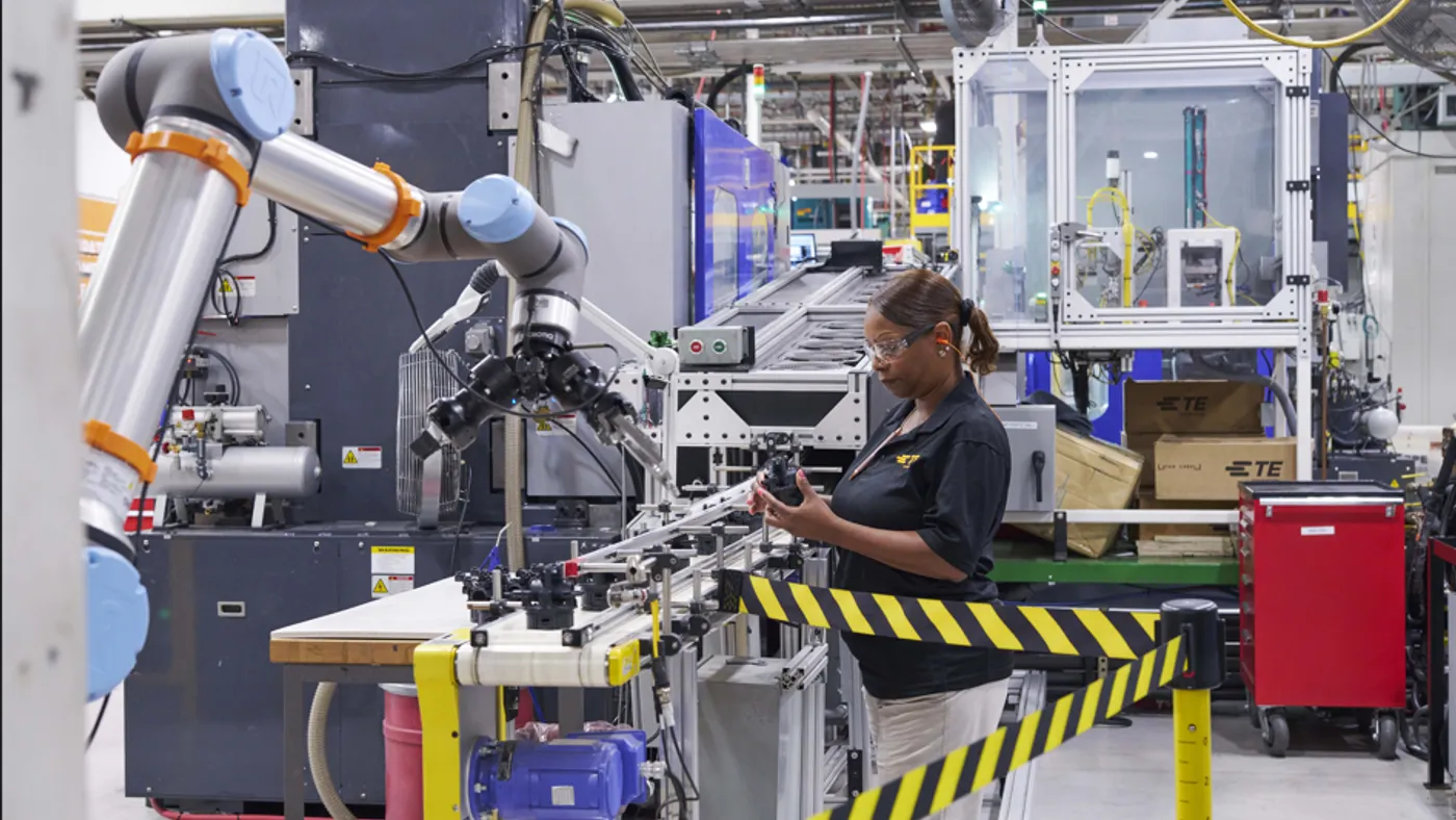 A TE Connectivity employee works the factory floor.