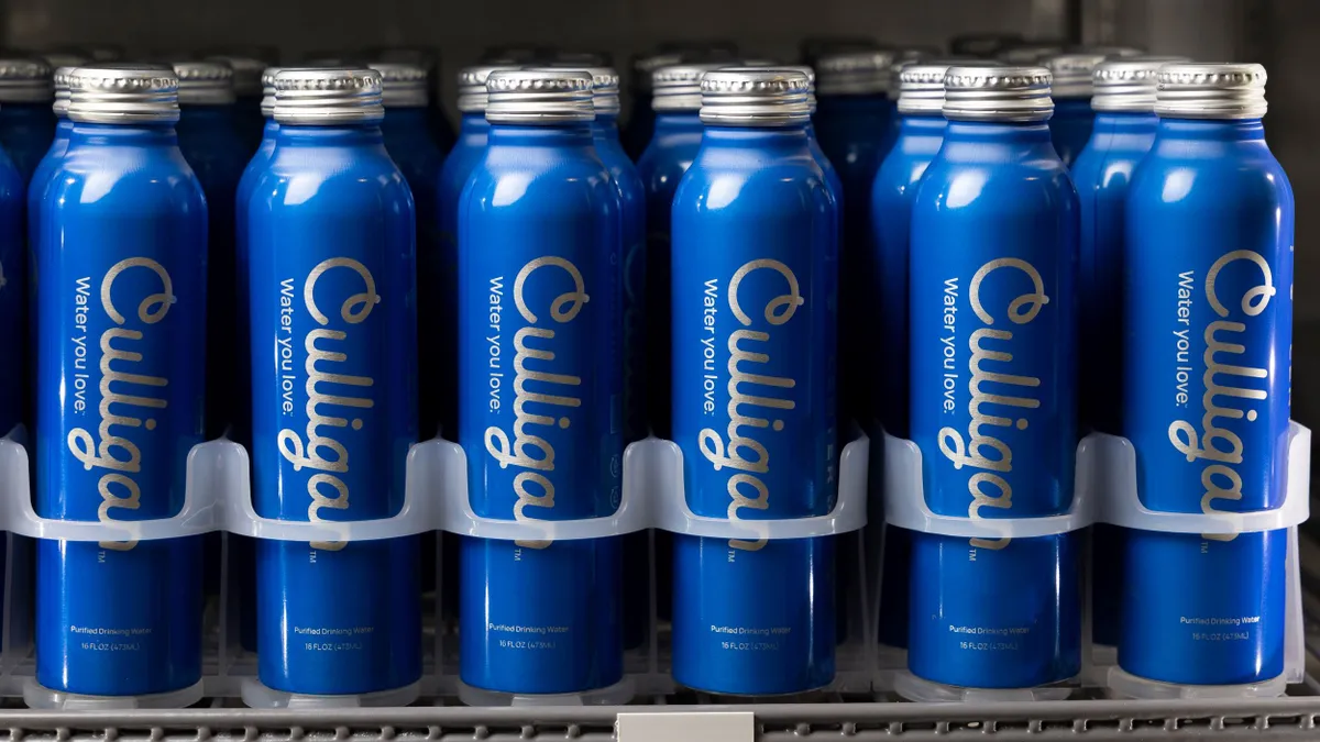 Culligan aluminum water bottles lined up in a beverage refrigerator