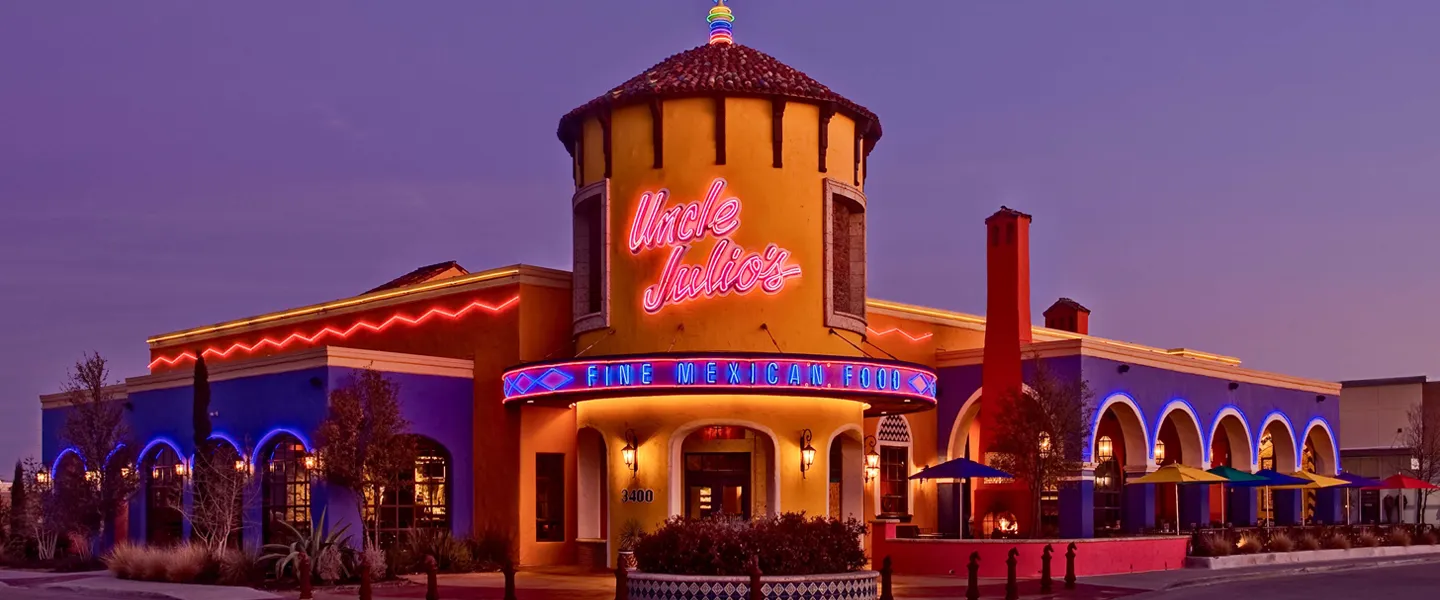 An evening photo of Uncle Julio's restaurant with dim lighting