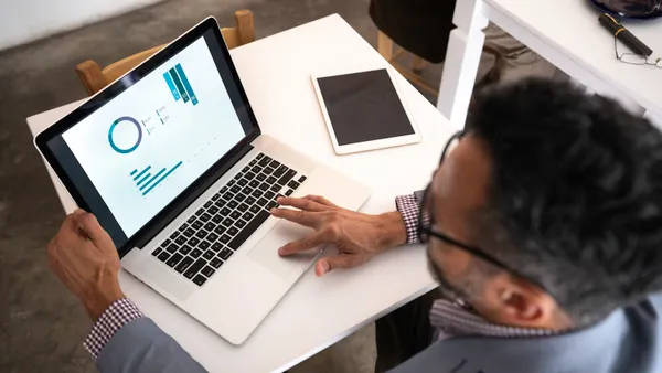 a close up of a business person looking at a chart