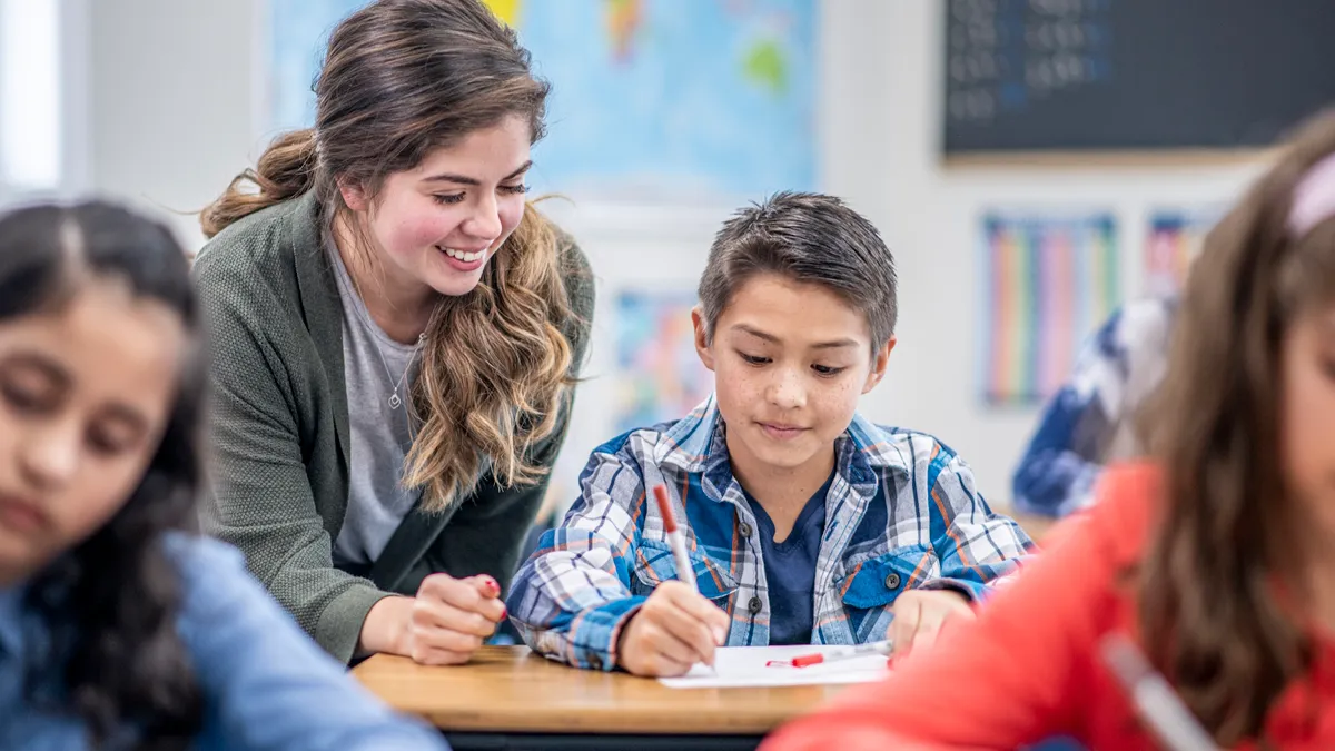 Teacher Helping a Student