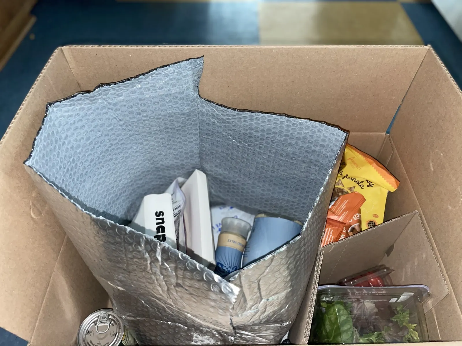 Close up of insulated bag and ice packs in an order from Misfits Market