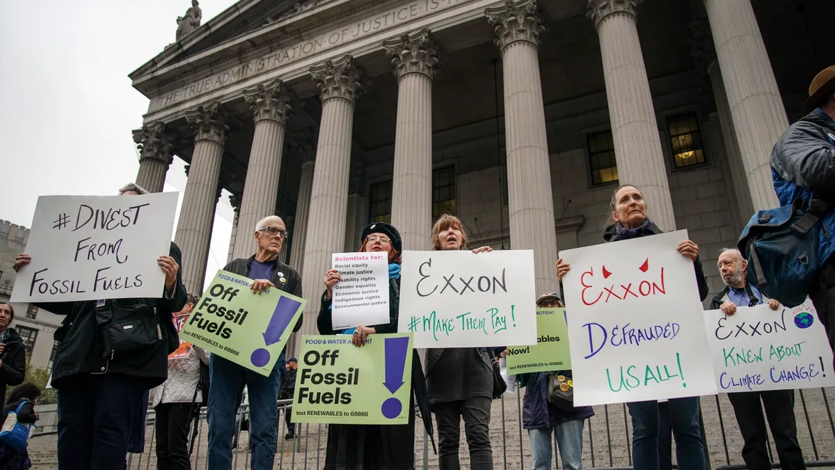 Environmental activists seen protesting outside the New York Supreme Court.