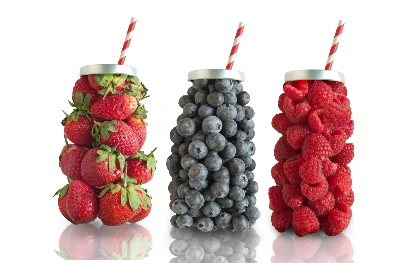 strawberries, blueberries and raspberries are in shape clusters that look like drink bottles. There's a silver top on each, and a red and white straw sticking out.