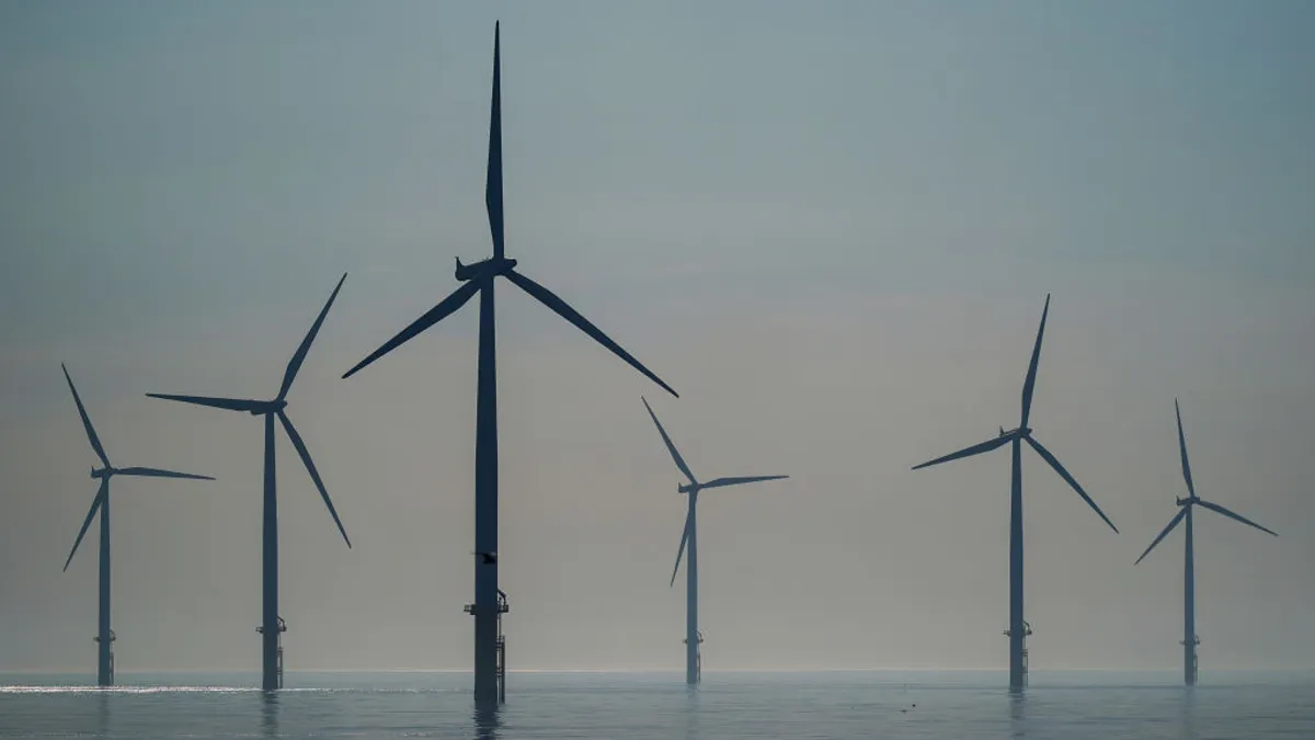 The sun rises over the EDF energy offshore windfarm on July 19, 2024 in Redcar, England.