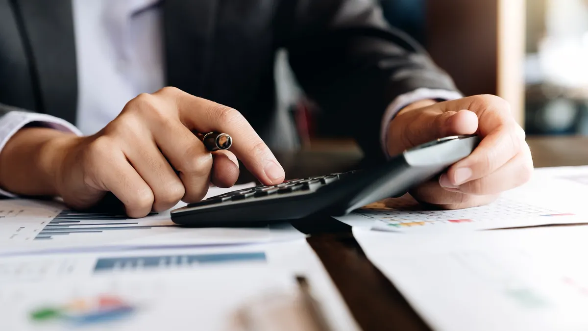 Businessman analyzing investment charts