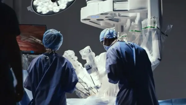 A surgeon using a davinci intuitive robot