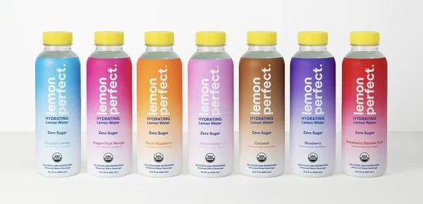 Seven bottles of Lemon Perfect flavored water with brightly colored labels that describe the various flavors.