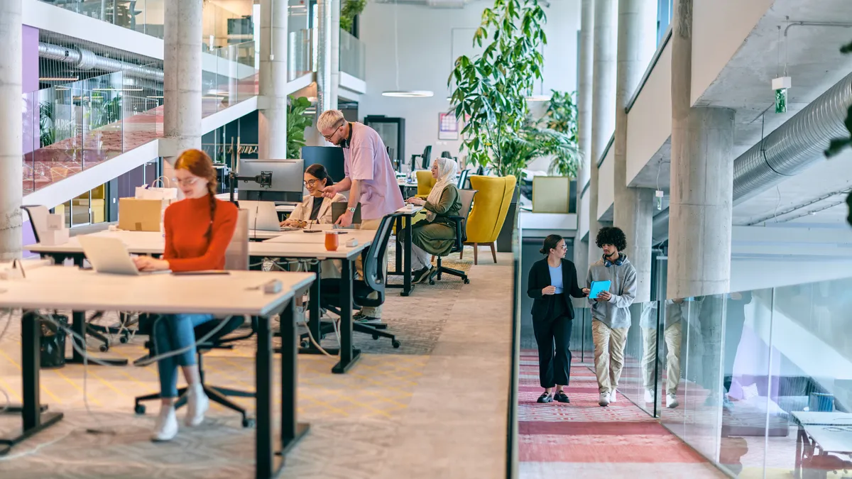 Employees working in a modern office.