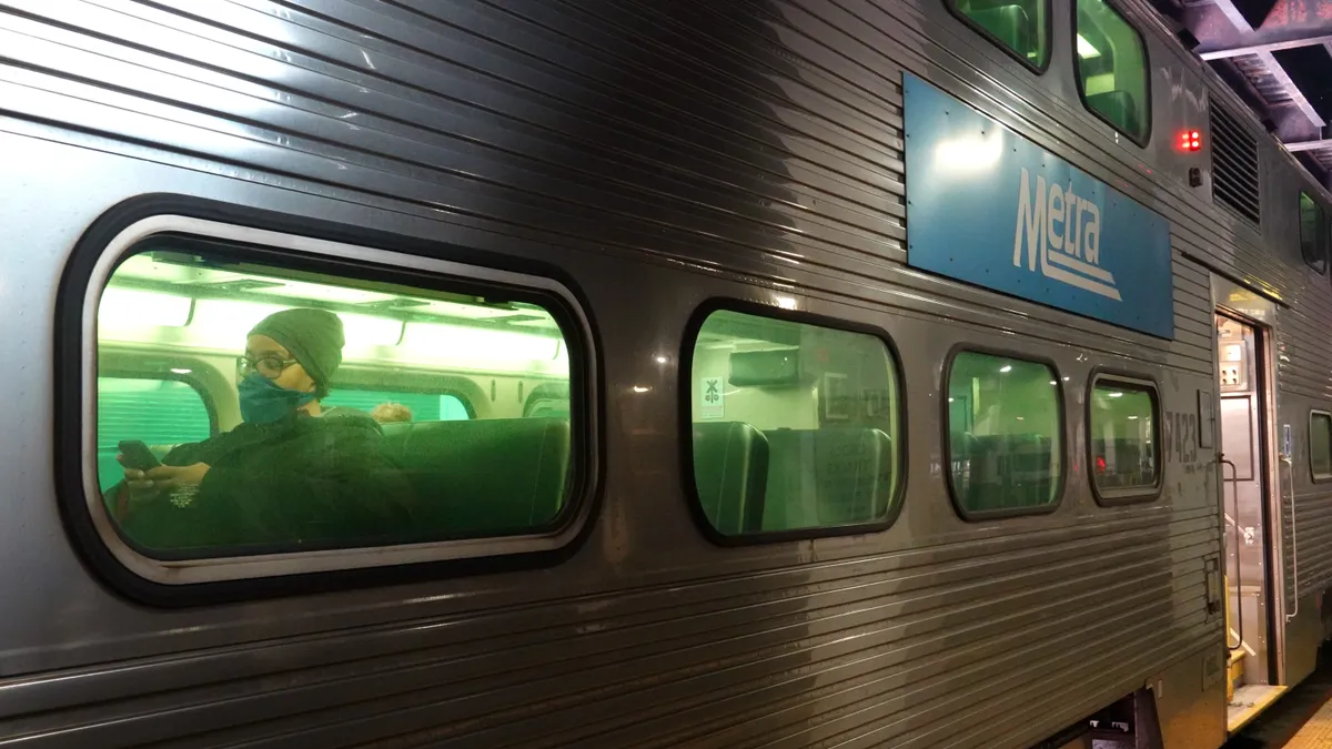 A passenger rides a Metra commuter train out of Union Station in Chicago, Illinois.