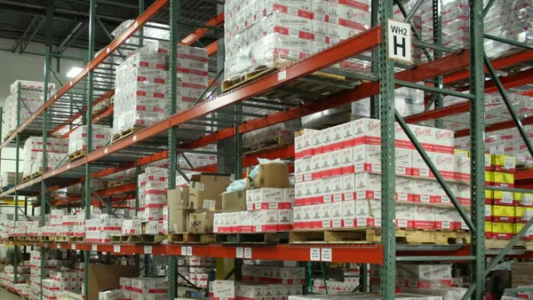 white and red cardboard boxes on shelf