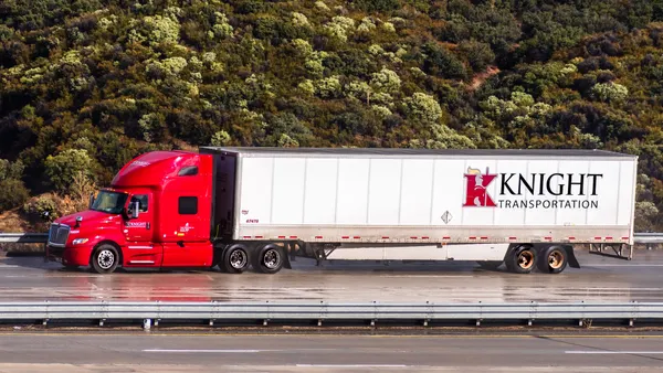 Knight Transportation truck driving on the freeway in California.