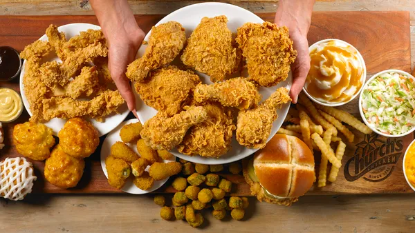 An overhead view of fried chicken and sides.