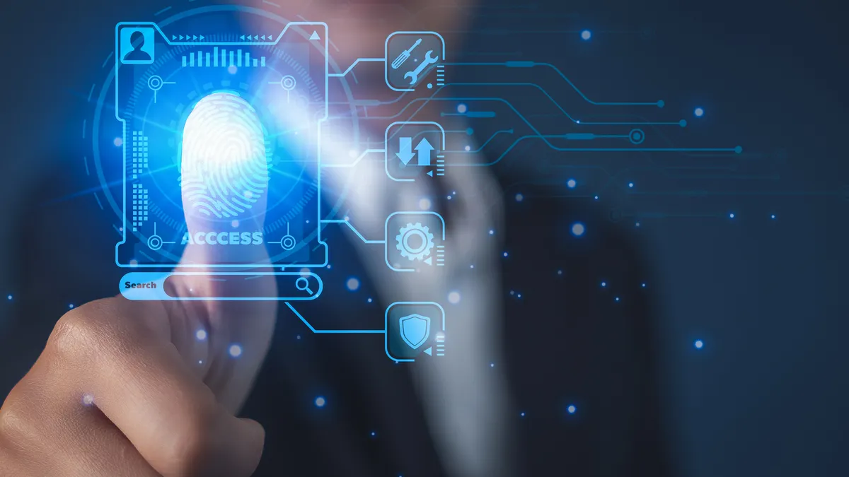 Businessman using fingerprint identification to access personal financial data, biometrics security