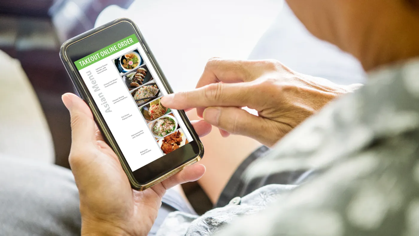 Ordering takeout and delivery convenience food from an online Asian restaurant delivery meal from a smart phone.