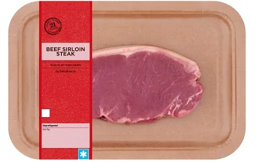 Sainsbury's beef sirloin steak on a cardboard tray.