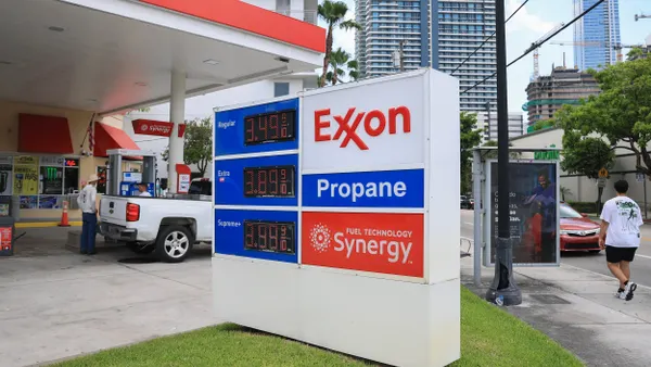 Customers at an Exxon gas station on May 22, 25 in Miami, Florida