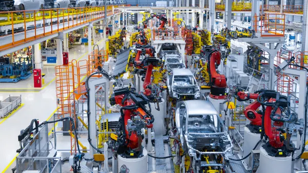 Overhead view of an automotive assembly line with robotics
