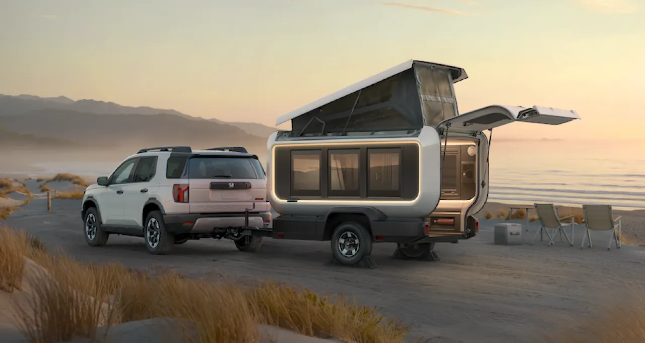 The Honda Base Station RV parked behind a Honda Passport SUV.