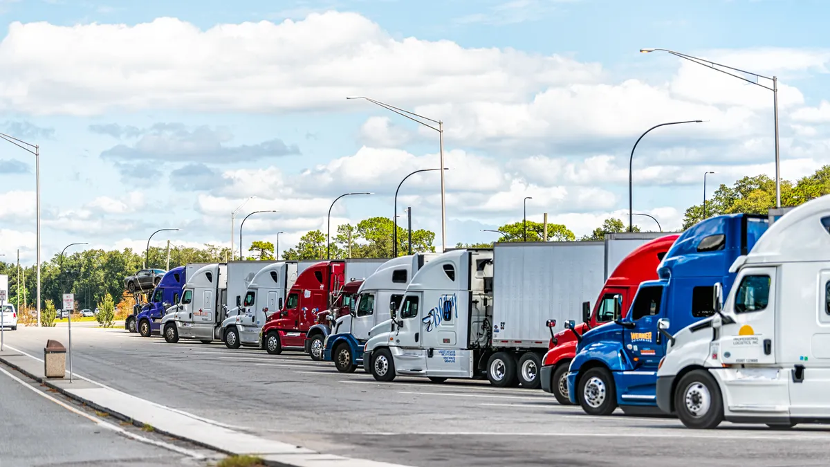 A parking area with trucks of different colors along Interstate 4 near Orlando, Florida.