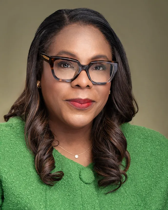 Headshot of a woman in business attire.