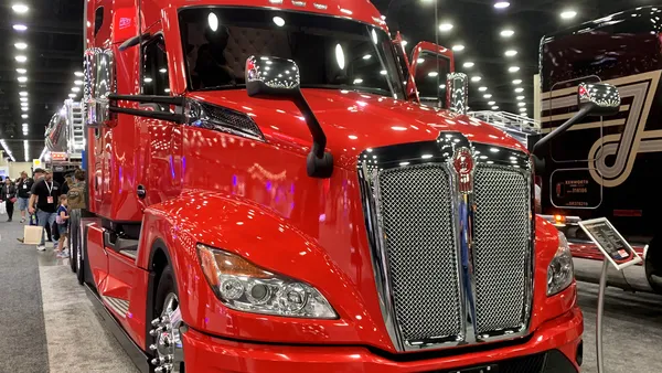 A red 2023 Kenworth T680 at the Mid-America Trucking Show.