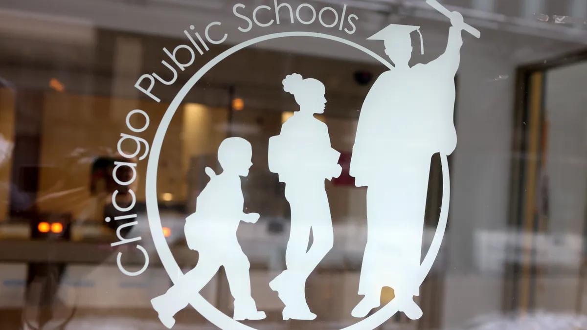 A sign that says "Chicago Public Schools" is displayed on a glass door.