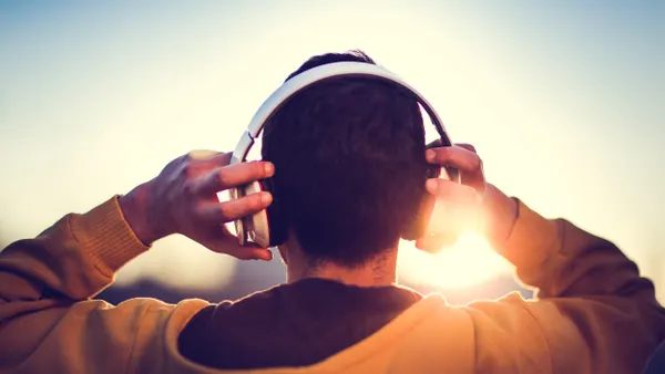Man listening to music with headphones on.