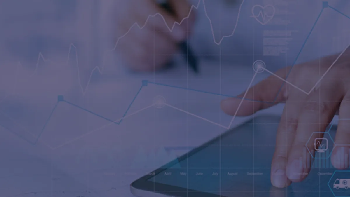 One hand in the distance has a marker, the other in focus is reaching to tap a tablet. There is a blue filter and some graph designs overlaying the picture.