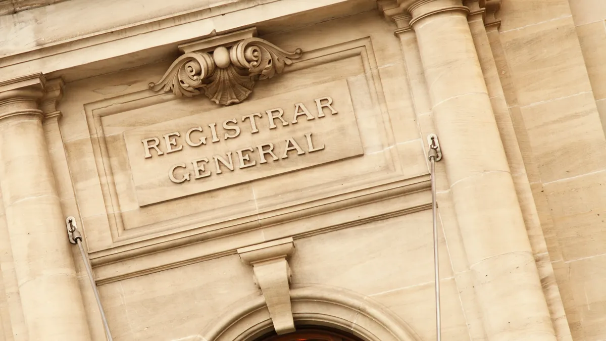 A stone sign reads "registrar general."